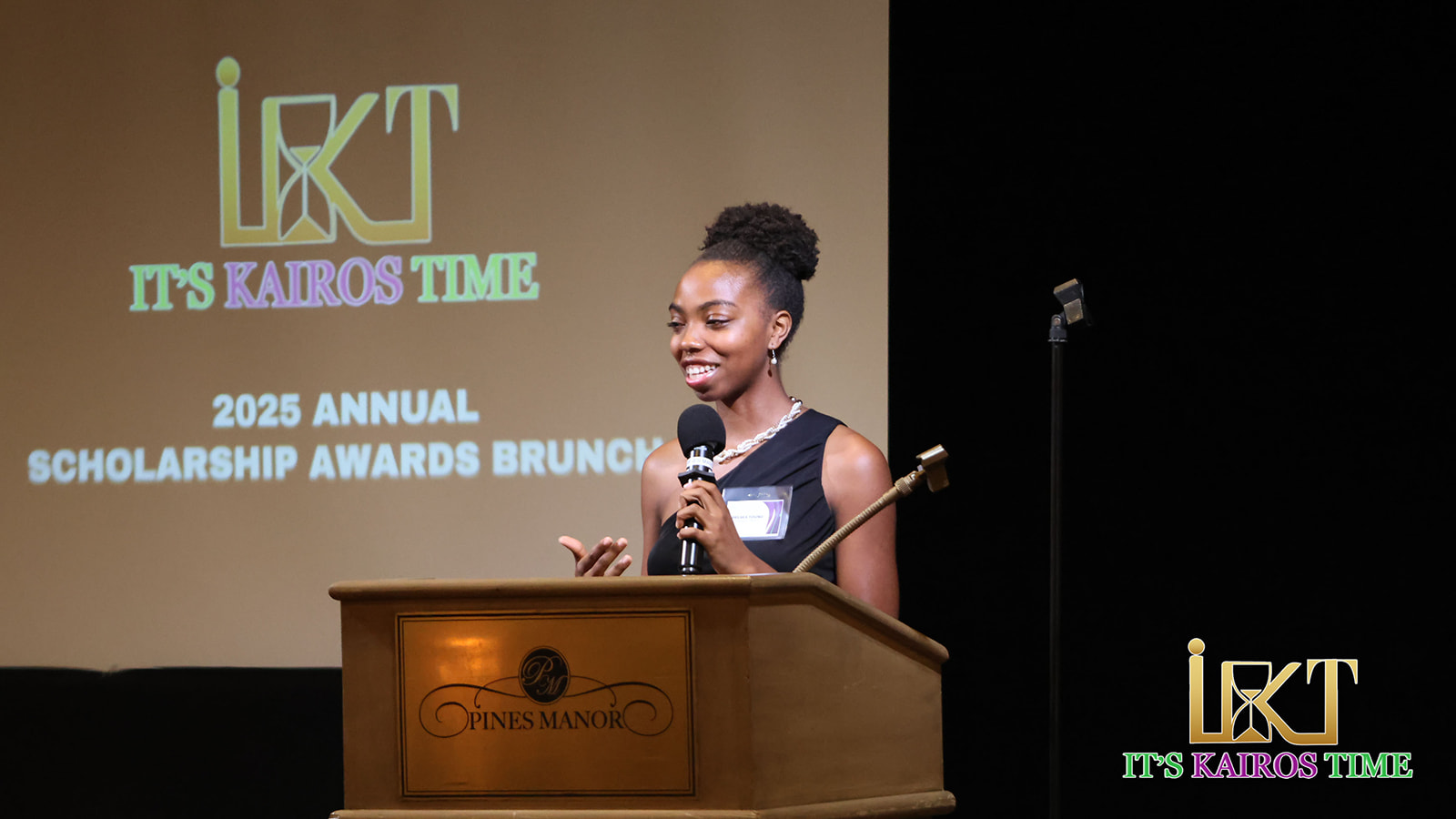Woman speaking at scholarship awards podium